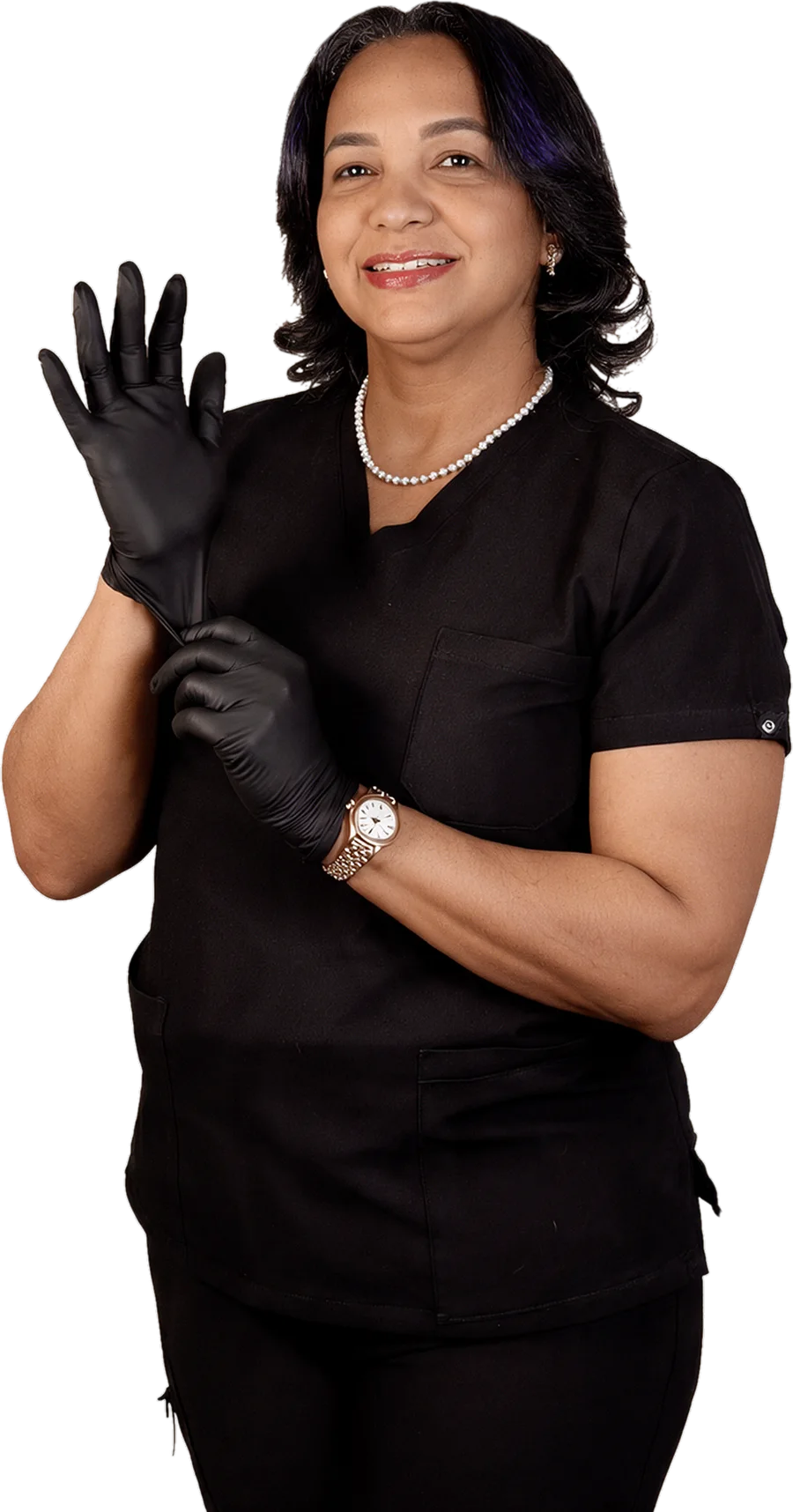 Dra. Odalis de Jesus, odontóloga, sonriendo mientras se coloca los guantes